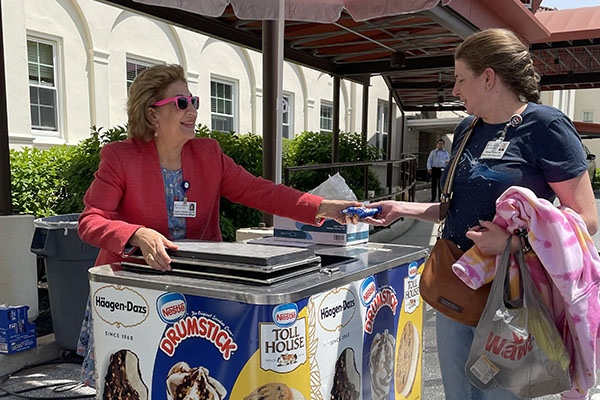 Angela Coladonato, Senior Vice President Nursing/Chief Nursing Officer hands out ice cream treats to employees as a way to say thank you for their work during the COVID-19 pandemic. 